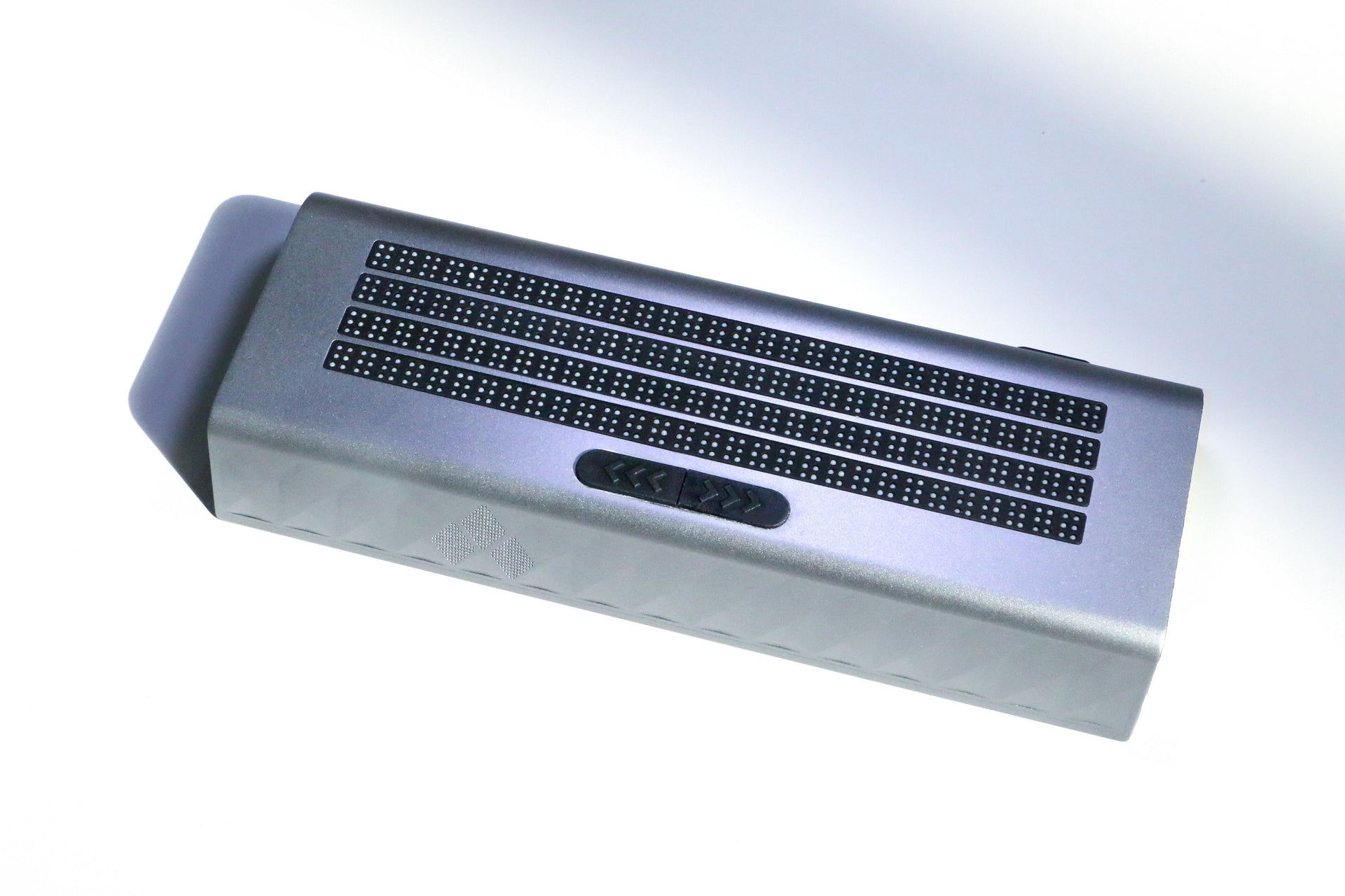 Zeta‑120 multi‑line refreshable braille display, 4 rows 120 braille cells metallic silver aluminum housing, top‑down product studio shot