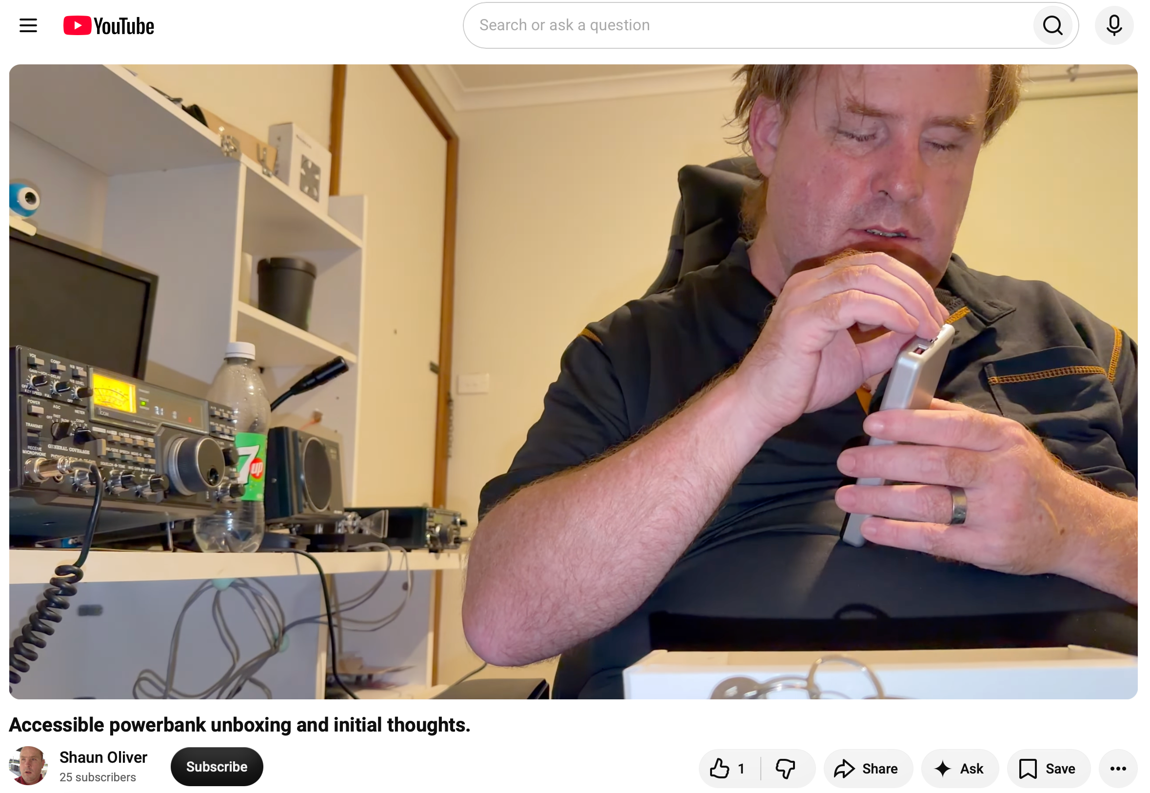YouTube video screenshot of Shaun Oliver examining the XO accessible power bank during an unboxing.