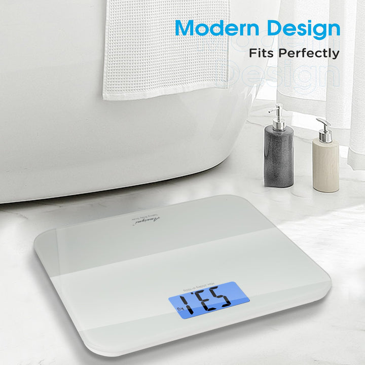 Slim modern‑style talking digital scale on marble bathroom floor, minimalist tempered‑glass design matches home decor